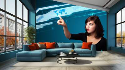 Businesswoman pressing high tech type of modern buttons Wall mural