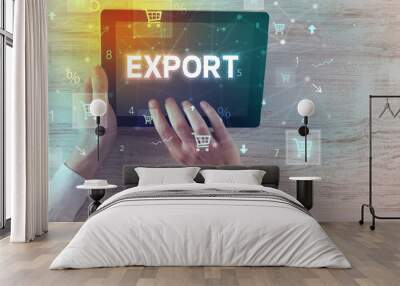 Close-up of a hand holding tablet with EXPORT inscription, online shopping concept Wall mural