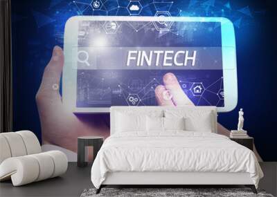 Close-up of a tablet searching FINTECH inscription, hi-tech computing concept Wall mural