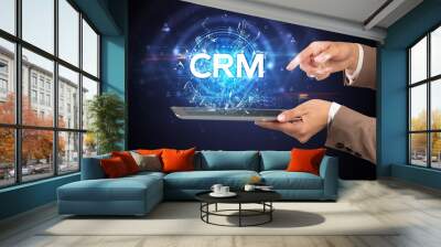 Close-up of a touchscreen with CRM abbreviation, modern technology concept Wall mural