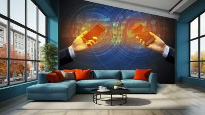 Close up of two smartphones syncing business data Wall mural