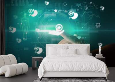 Doctor hand pressing futuristic health device with medical symbol on screen Wall mural