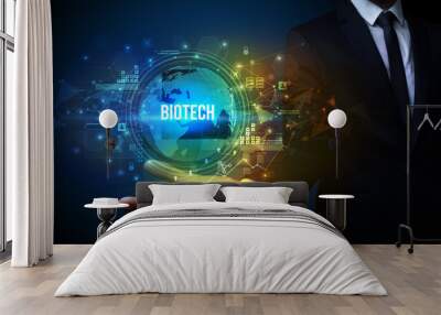 Elegant hand holding BIOTECH inscription, digital technology concept Wall mural