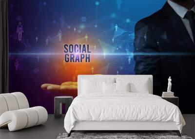 Elegant hand holding SOCIAL GRAPH inscription, social networking concept Wall mural