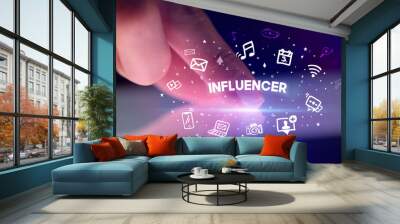 Finger touching tablet with drawn social media icons and INFLUENCER inscription, social networking concept Wall mural