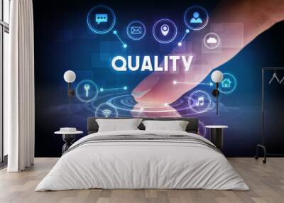 Finger touching tablet with web technology icons and QUALITY inscription, web technology concept Wall mural