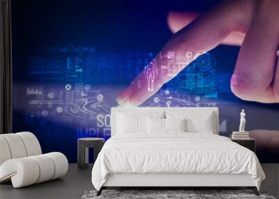 Finger touching tablet with web technology icons and SOFTWARE IMPLEMENTATION inscription Wall mural