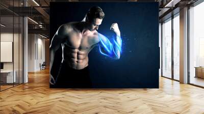 Fit athlete lifting weight with blue muscle light concept Wall mural