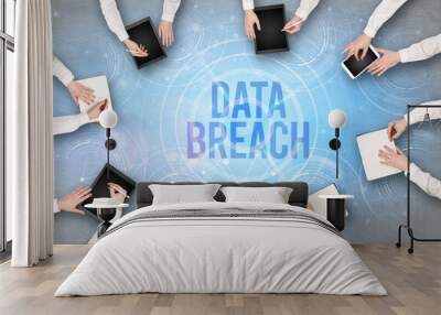 Group of people in front of a laptop with DATA BREACH insciption, web security concept Wall mural