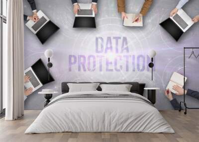 Group of people in front of a laptop with DATA PROTECTION insciption, web security concept Wall mural