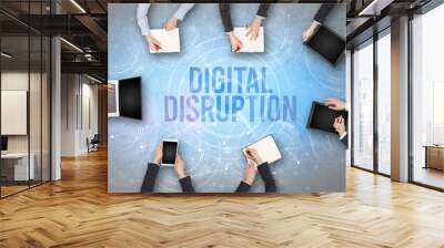 Group of people in front of a laptop with DIGITAL DISRUPTION insciption, web security concept Wall mural