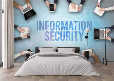 Group of people in front of a laptop with INFORMATION SECURITY insciption, web security concept Wall mural