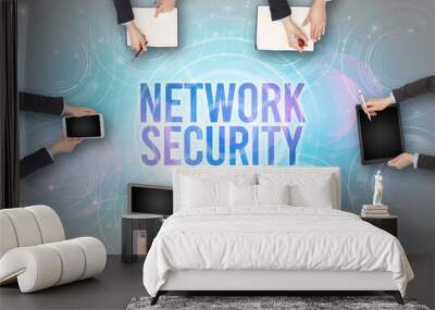 Group of people in front of a laptop with NETWORK SECURITY insciption, web security concept Wall mural