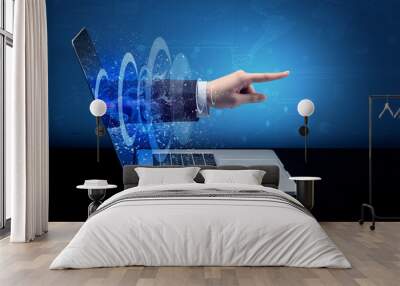 Hand coming out of a laptop with sparkling effects
 Wall mural