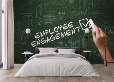 Hand drawing EMPLOYEE ENGAGEMENT inscription with white chalk on blackboard, new business concept Wall mural