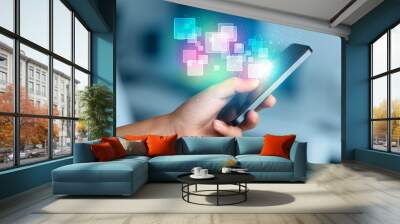 hand holding smart phone with abstract glowing squares Wall mural