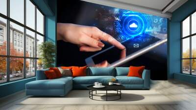 Hand holding tablet with cloud storage technology concept
 Wall mural