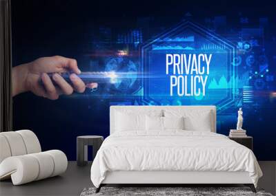 hand holding wireless peripheral with PRIVACY POLICY inscription, cyber security concept Wall mural