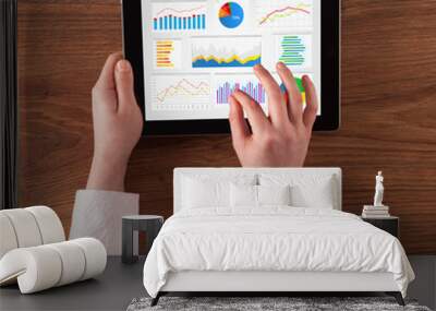 Hand making diagrams and charts on tablet Wall mural