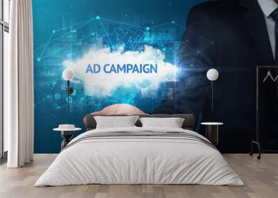 Hand of Businessman holding AD CAMPAIGN inscription, successful business concept Wall mural