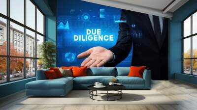 Hand of Businessman holding DUE DILIGENCE inscription, business success concept Wall mural