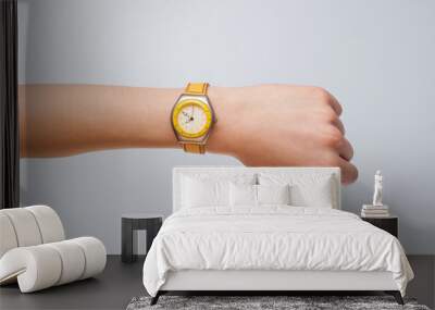 Hand with watch showing precise time Wall mural