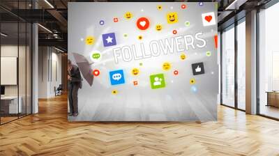 Handsome businessman defending with umbrella from FOLLOWERS inscription, social networking concept Wall mural