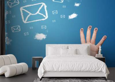 Happy smiley fingers looking at mail icons made out of clouds Wall mural