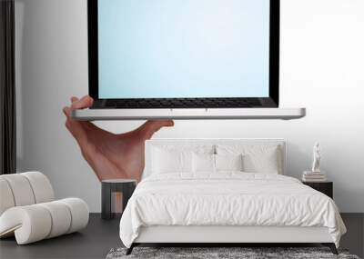 male hand holding a laptop Wall mural