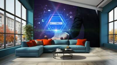 Man hand holding CONNECTION inscription, social media concept Wall mural