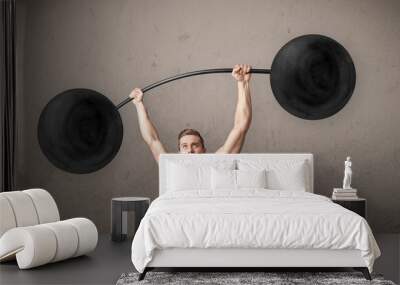 muscular man lifting weights Wall mural