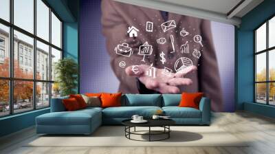 Office worker with drawn icons in the palm Wall mural