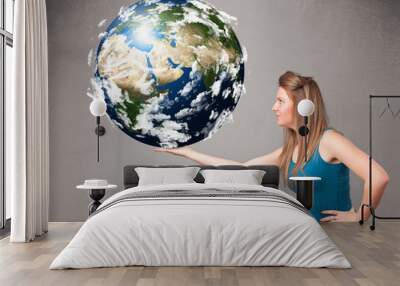 Pretty girl holding 3d planet earth Wall mural