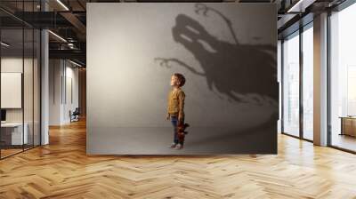 Scary ghost shadow in a dark empty room with a cute blond child
 Wall mural