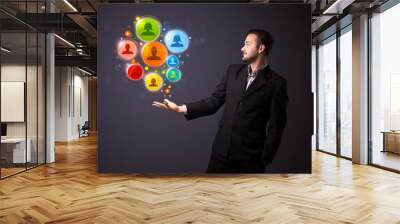 Social network icons in the hand of a businessman Wall mural