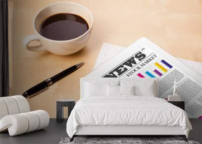 Tablet pc shows news on screen with a cup of coffee on a desk Wall mural