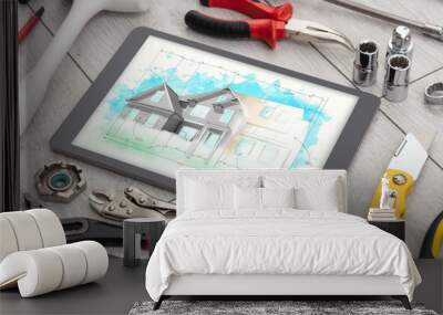 Tablet with construction tools and house plan concept Wall mural