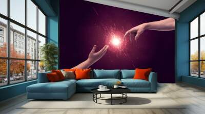 Touching hands light up sparkle in space Wall mural