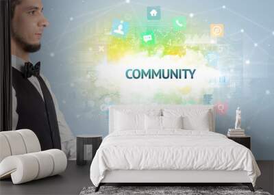 Waiter serving social networking concept with COMMUNITY inscription Wall mural