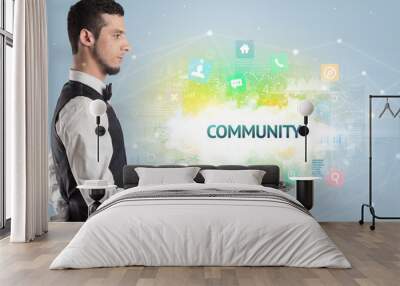 Waiter serving social networking concept with COMMUNITY inscription Wall mural