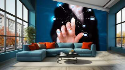 Woman pressing virtual messaging type of icons Wall mural