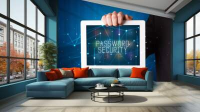 Young business person working on tablet and shows the digital sign: PASSWORD SECURITY Wall mural