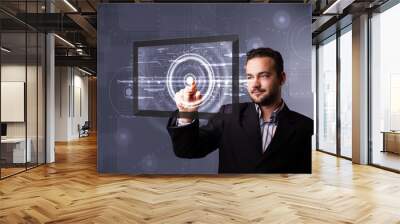 young businessman touching modern technology tablet Wall mural