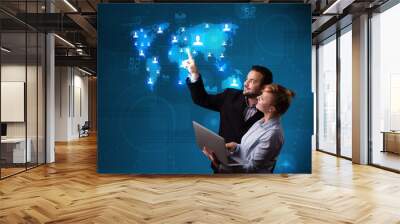 Young couple choosing from social network map Wall mural