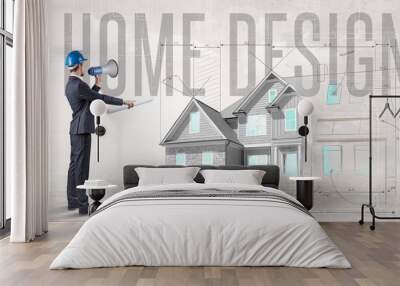 Young engineer holding blueprint concept Wall mural