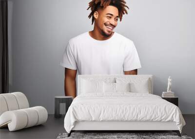 a young male model wearing a blank T shirt for use as mockup with blank background Wall mural