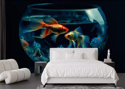 Fishes inside a glass bowl on a dark background Wall mural