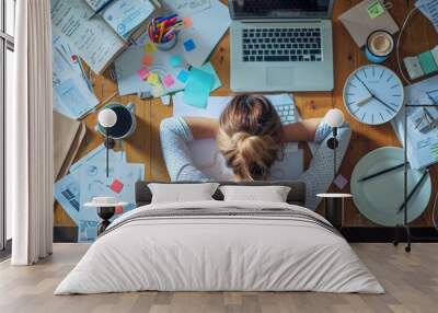 A female professional sleeping on a messy office desk Wall mural