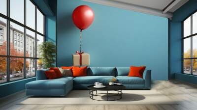 Balloon and gift box flying in air. Wall mural