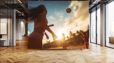 Beautiful girl close-up view in a sand beach volleyball game at sunset. Summer tropical vacation concept. Wall mural